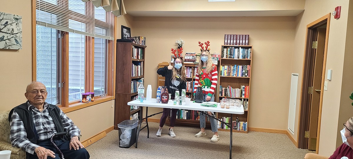 Prairie Crossing tenants with volunteers during Christmas season